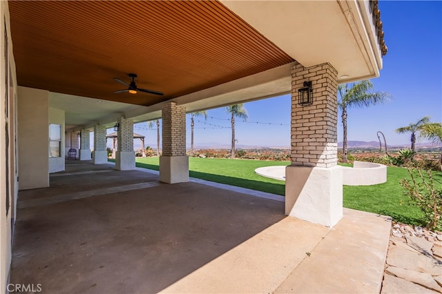 view of patio / terrace featuring ceiling fan