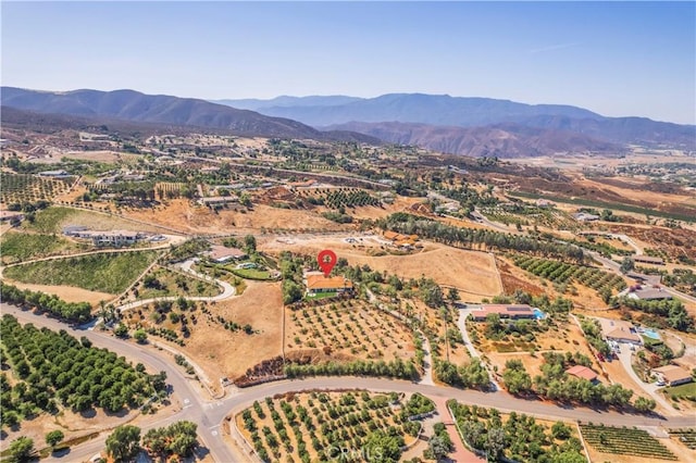 drone / aerial view with a mountain view and a rural view