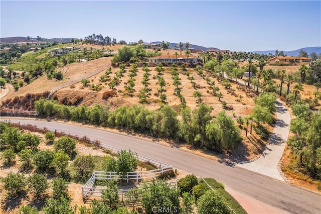 drone / aerial view featuring a rural view and a mountain view