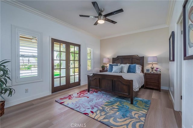 bedroom with crown molding, access to outside, light wood-type flooring, and french doors