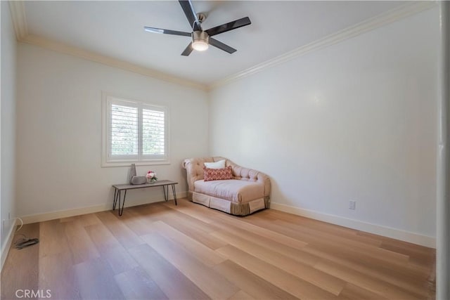 unfurnished room with crown molding, ceiling fan, and light wood-type flooring