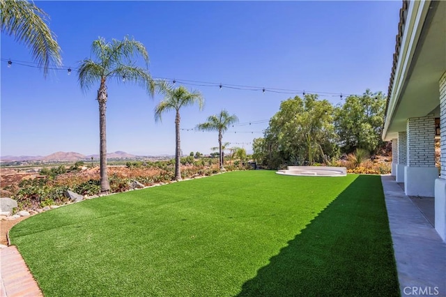 view of yard with a mountain view