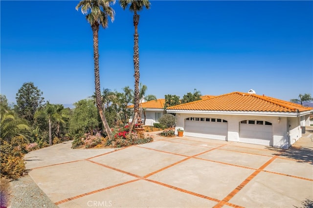 mediterranean / spanish-style house featuring a garage