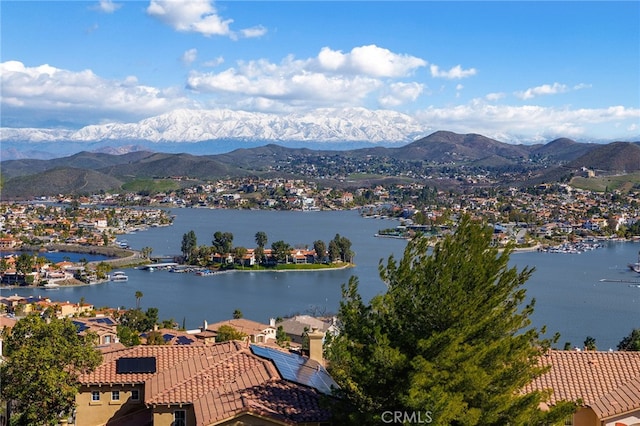 birds eye view of property featuring a water and mountain view