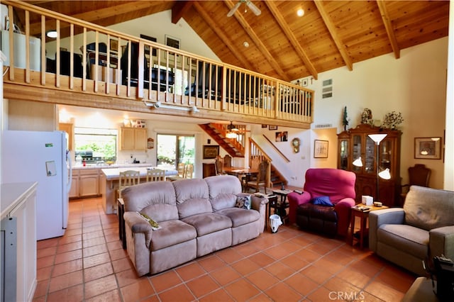 living room featuring ceiling fan, beam ceiling, high vaulted ceiling, wooden ceiling, and tile patterned flooring