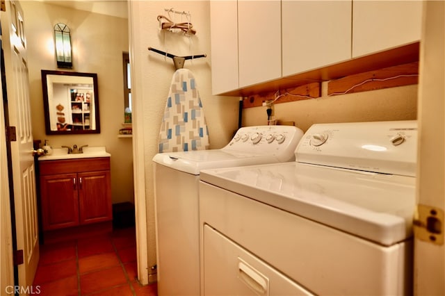 laundry area with washing machine and dryer and tile patterned floors