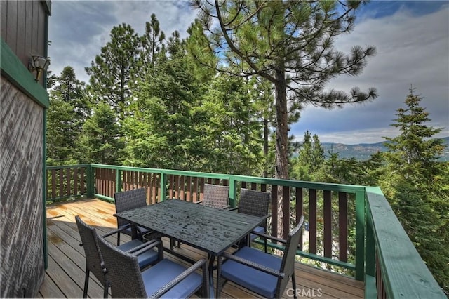 wooden terrace with a mountain view