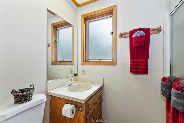 bathroom featuring toilet and vanity