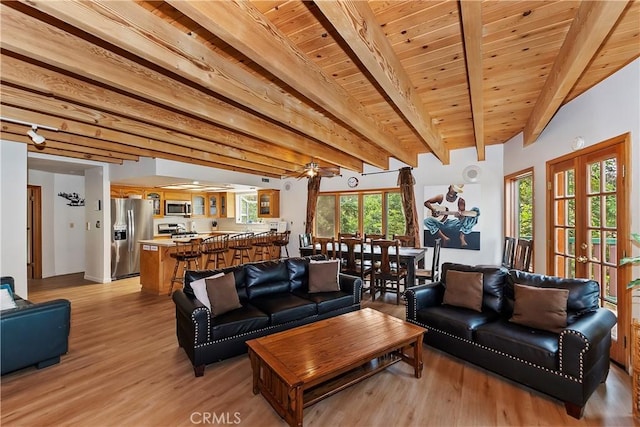 living room with wood ceiling, french doors, light hardwood / wood-style flooring, and beamed ceiling