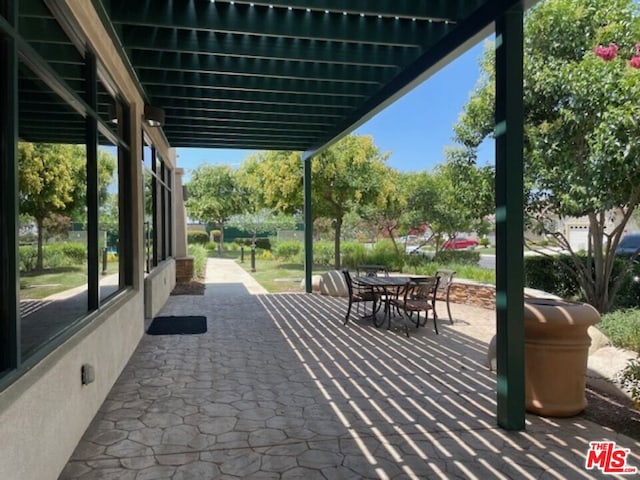 view of home's community with a patio area