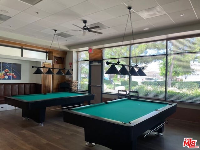 rec room with a paneled ceiling, ceiling fan, billiards, and dark hardwood / wood-style flooring