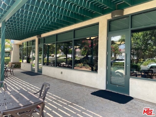 doorway to property with a patio