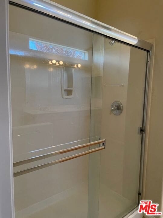 bathroom featuring walk in shower