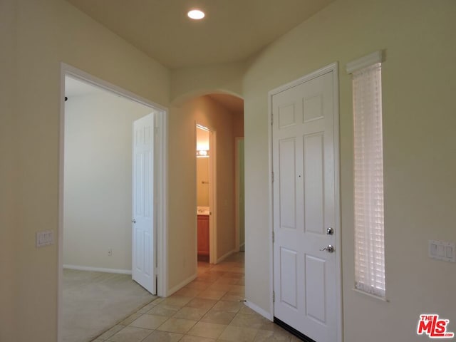 hallway with light carpet