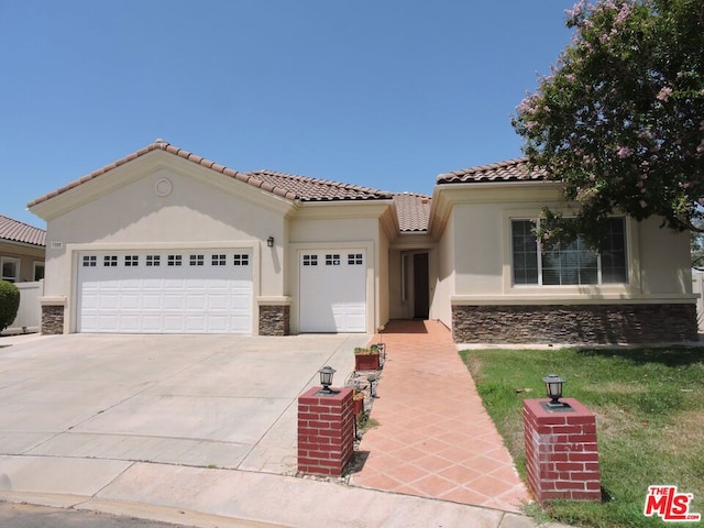 mediterranean / spanish-style home featuring a garage