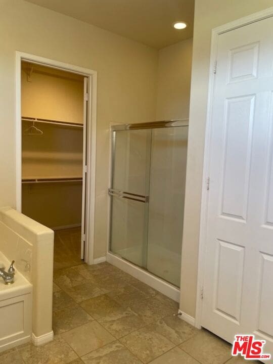 bathroom with independent shower and bath