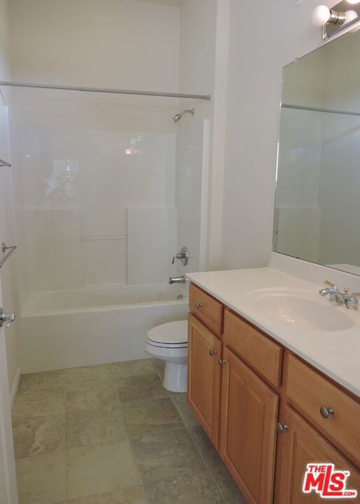 full bathroom with vanity, toilet, and bathtub / shower combination