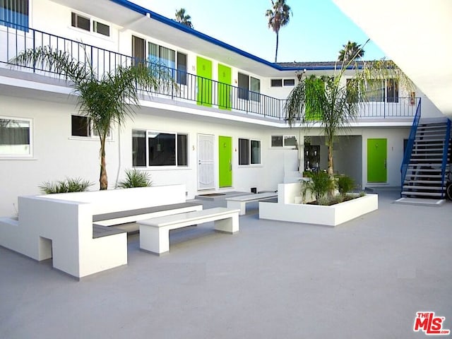 view of home's community with a patio area