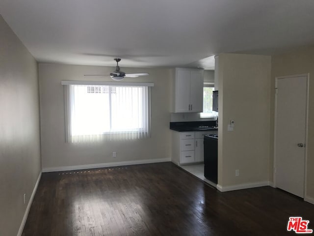 kitchen with white cabinetry, dark hardwood / wood-style floors, and ceiling fan