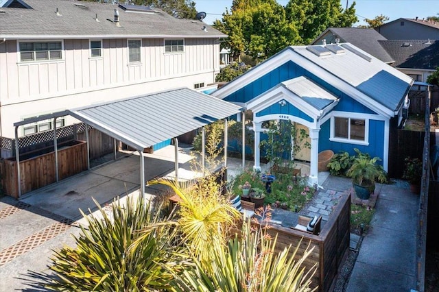 rear view of house featuring a carport