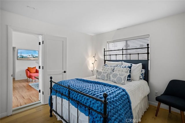 bedroom with wood-type flooring