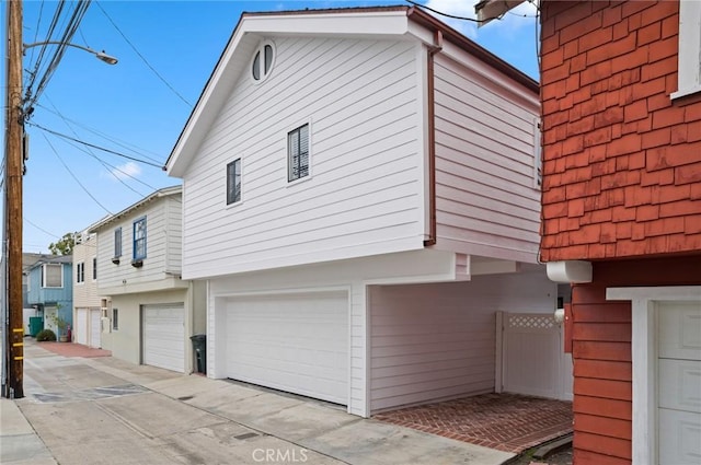 view of side of home with a garage