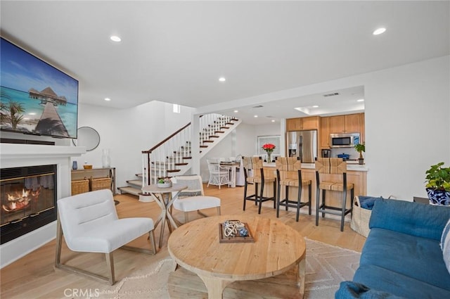 living room with light hardwood / wood-style floors