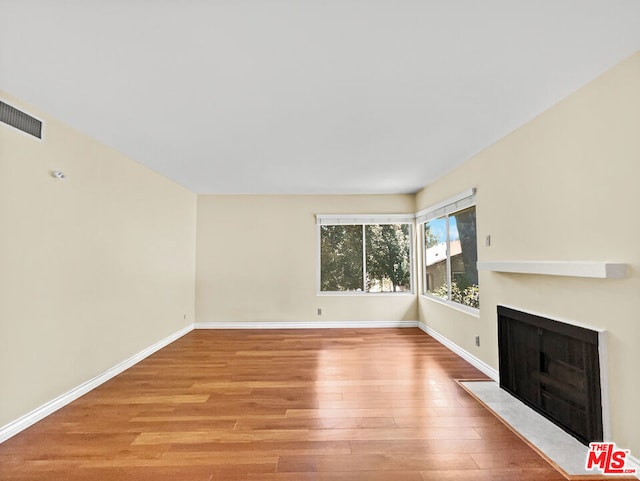 unfurnished living room featuring light hardwood / wood-style floors