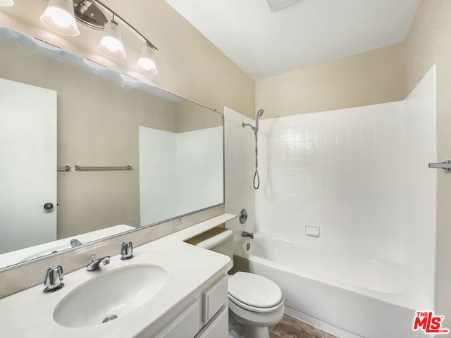 full bathroom with washtub / shower combination, vanity, and toilet