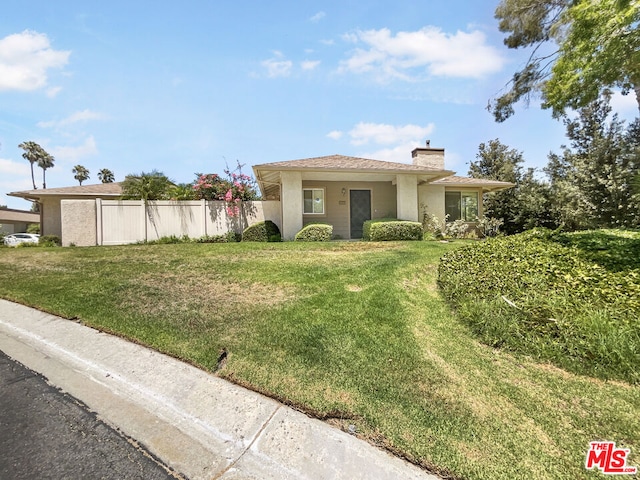 view of front of property with a front lawn