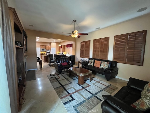 living room featuring ceiling fan