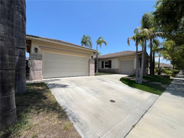 single story home with a garage