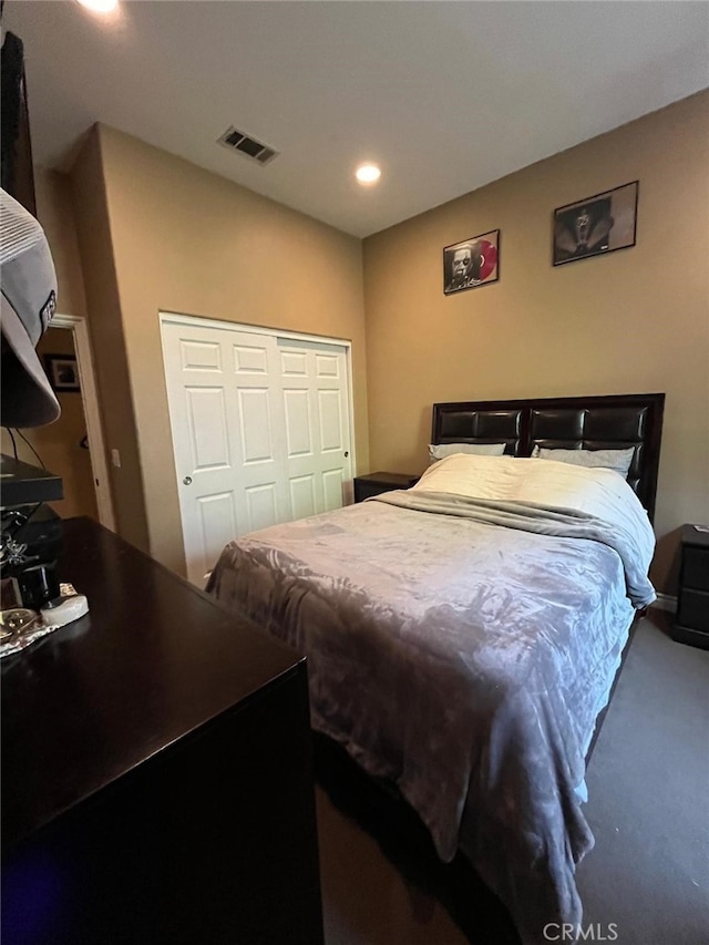 carpeted bedroom with a closet