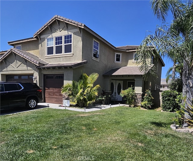 view of front of house with a garage and a front lawn