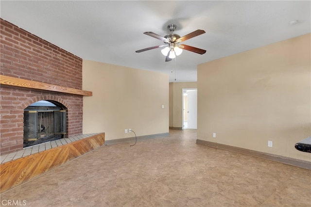 unfurnished living room featuring a fireplace and ceiling fan