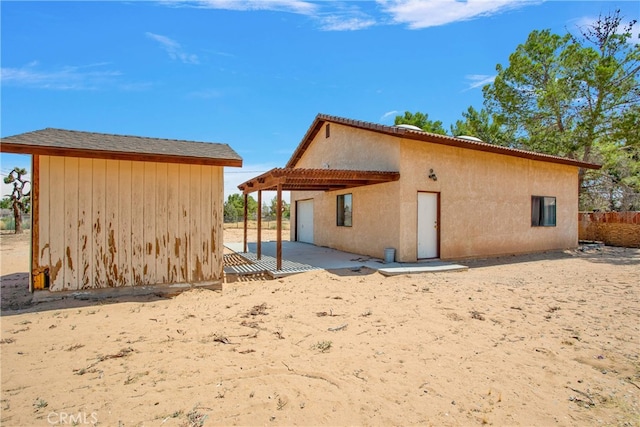 rear view of house featuring a patio area