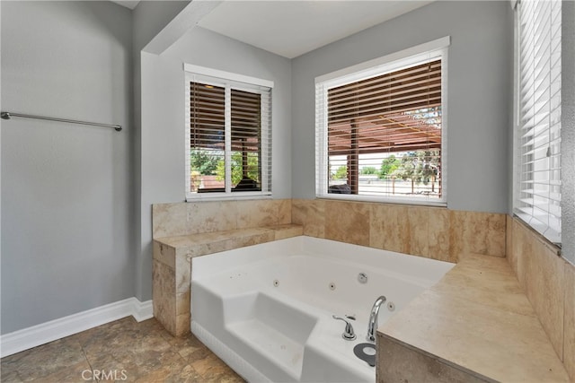 bathroom featuring tiled tub