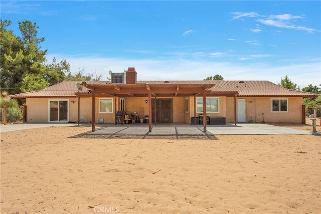 rear view of property featuring a patio