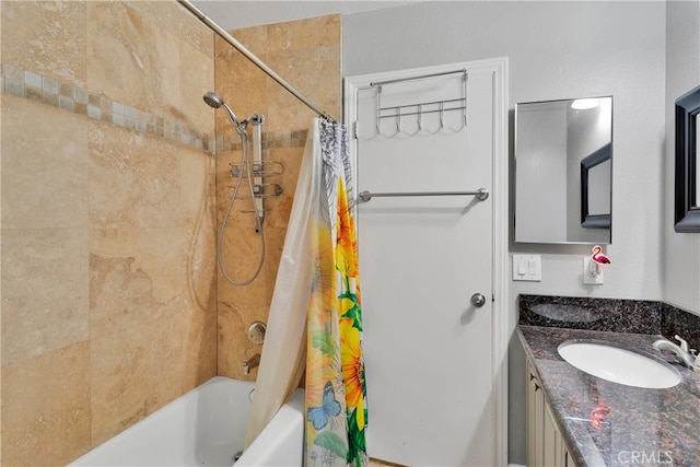 bathroom with shower / tub combo and vanity