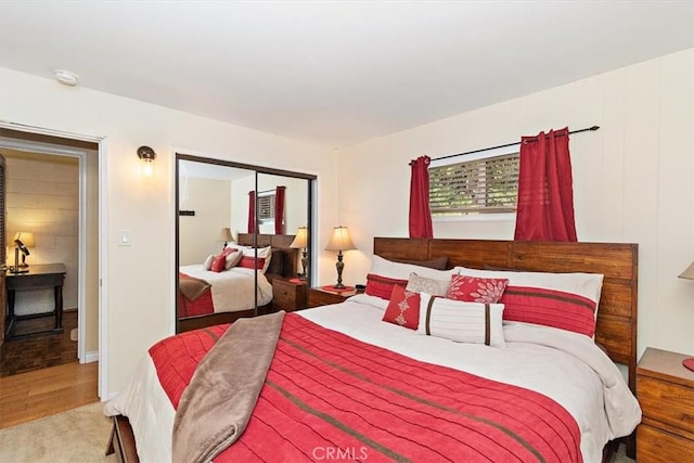 bedroom with carpet floors and a closet