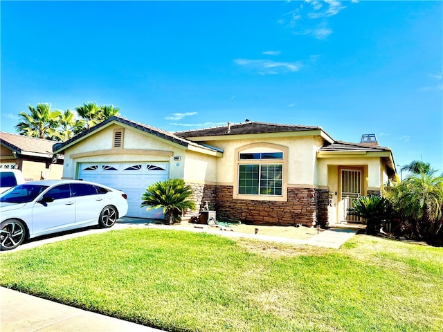 view of front of property with a garage and a front lawn