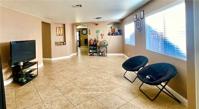 living area featuring tile patterned flooring