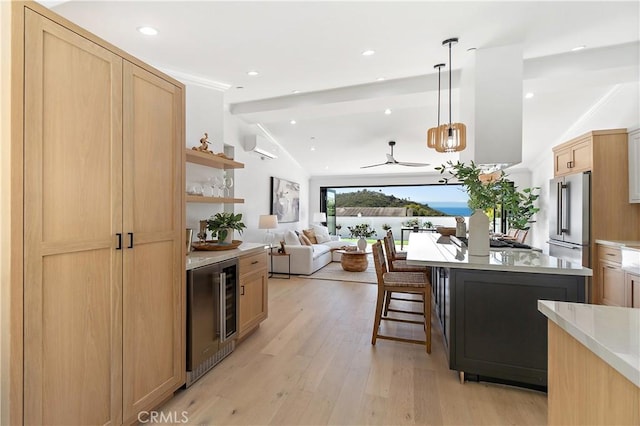 kitchen with high end fridge, wine cooler, lofted ceiling with beams, decorative light fixtures, and light brown cabinetry