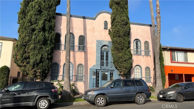 view of front of house featuring a balcony