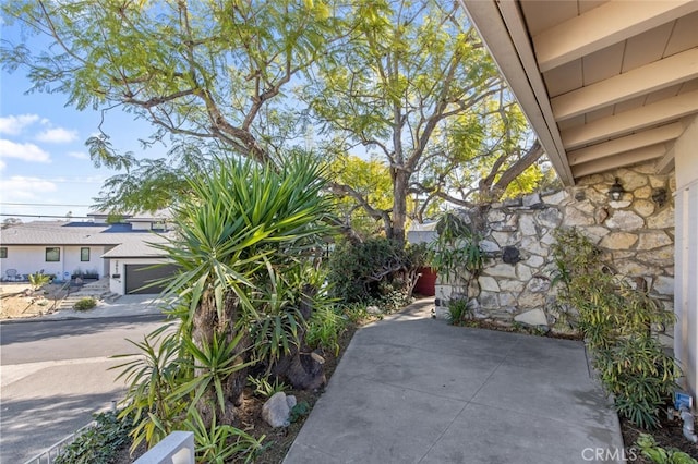 view of patio / terrace featuring a garage