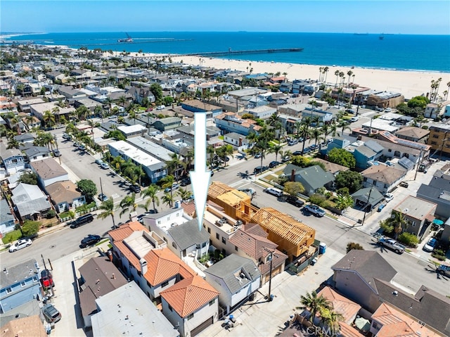 bird's eye view with a water view and a view of the beach