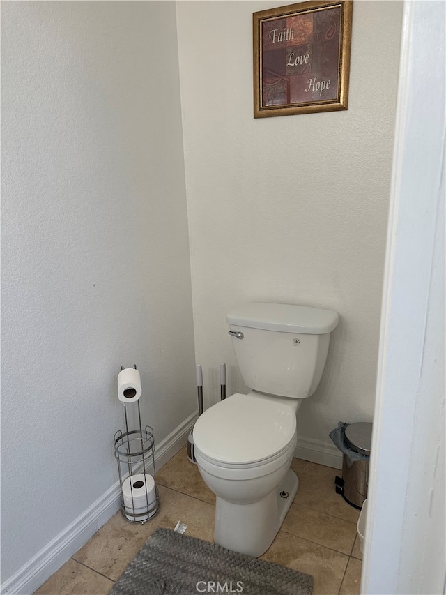 bathroom featuring tile patterned flooring and toilet