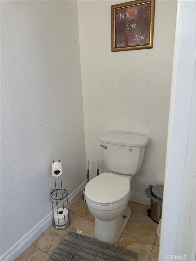 14136 Orizaba Ave, Paramount, CA 90723 - bathroom with tile patterned floors, baseboards, and toilet