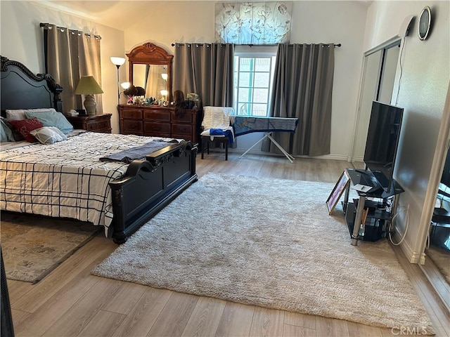 bedroom with hardwood / wood-style floors