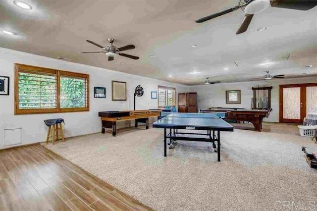 playroom with pool table, french doors, light wood-type flooring, and a healthy amount of sunlight